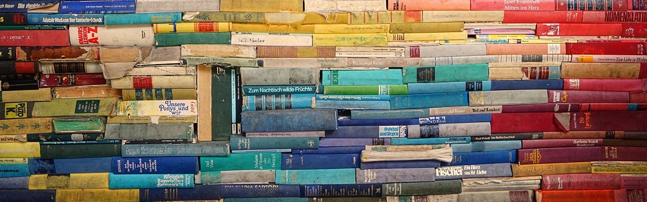 Decorative photograph of stacks of books